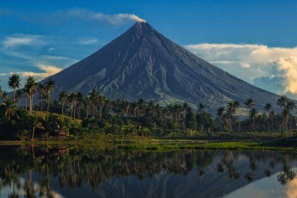 A stunning photo of Mayon Volcano, an active stratovolcano in the Philippines, known for its perfect cone shape.