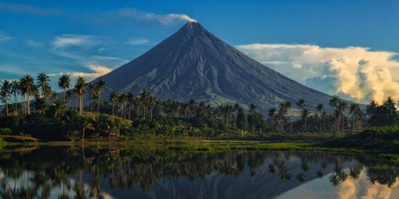 A stunning photo of Mayon Volcano, an active stratovolcano in the Philippines, known for its perfect cone shape.