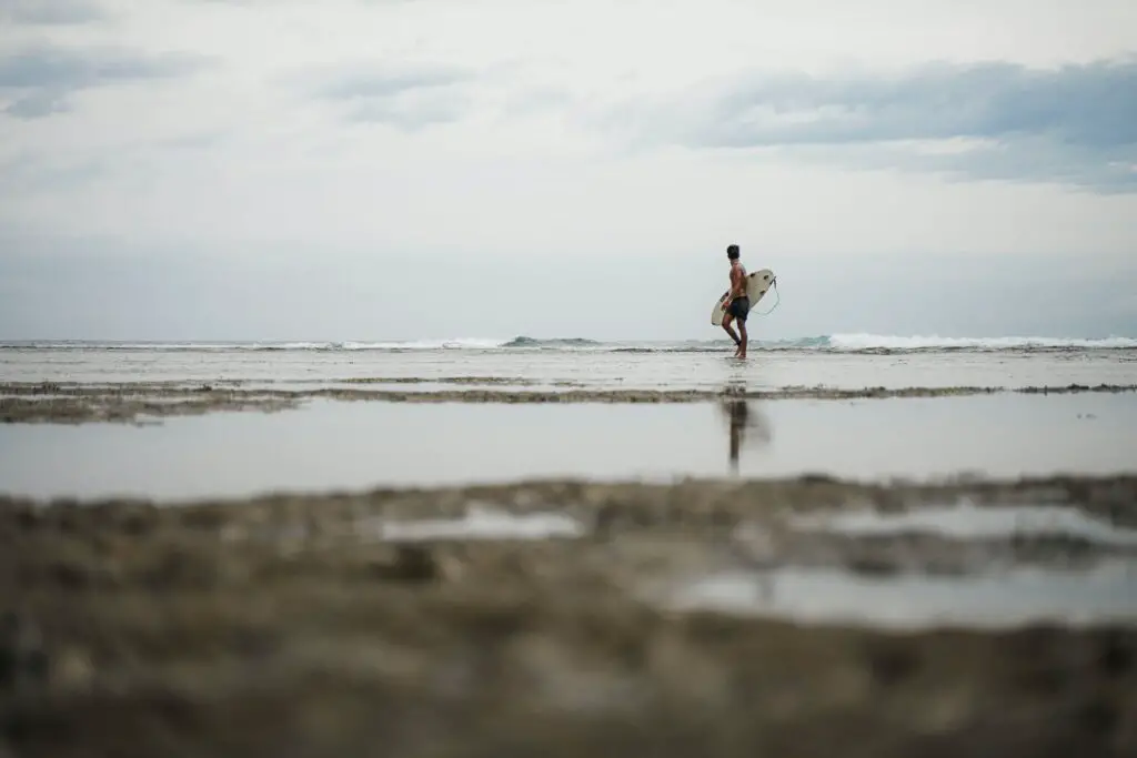 Surfer catching a wave in Siargao