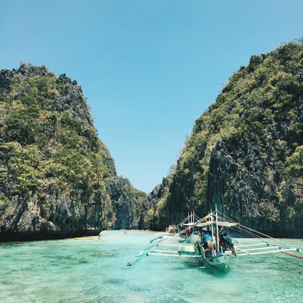 El Nido, Palawan with white and green sailboat