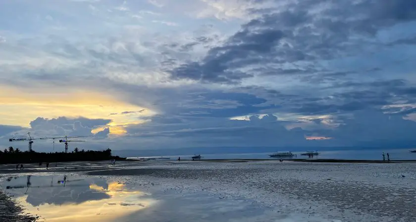 Vibrant sunset at Modala Beach Resort, with a golden sky reflecting over the serene ocean waters