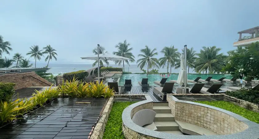 Infinity pool at Modala Beach Resort, offering a breathtaking view of the crystal-clear water seamlessly blending with the vast expanse of the horizon.